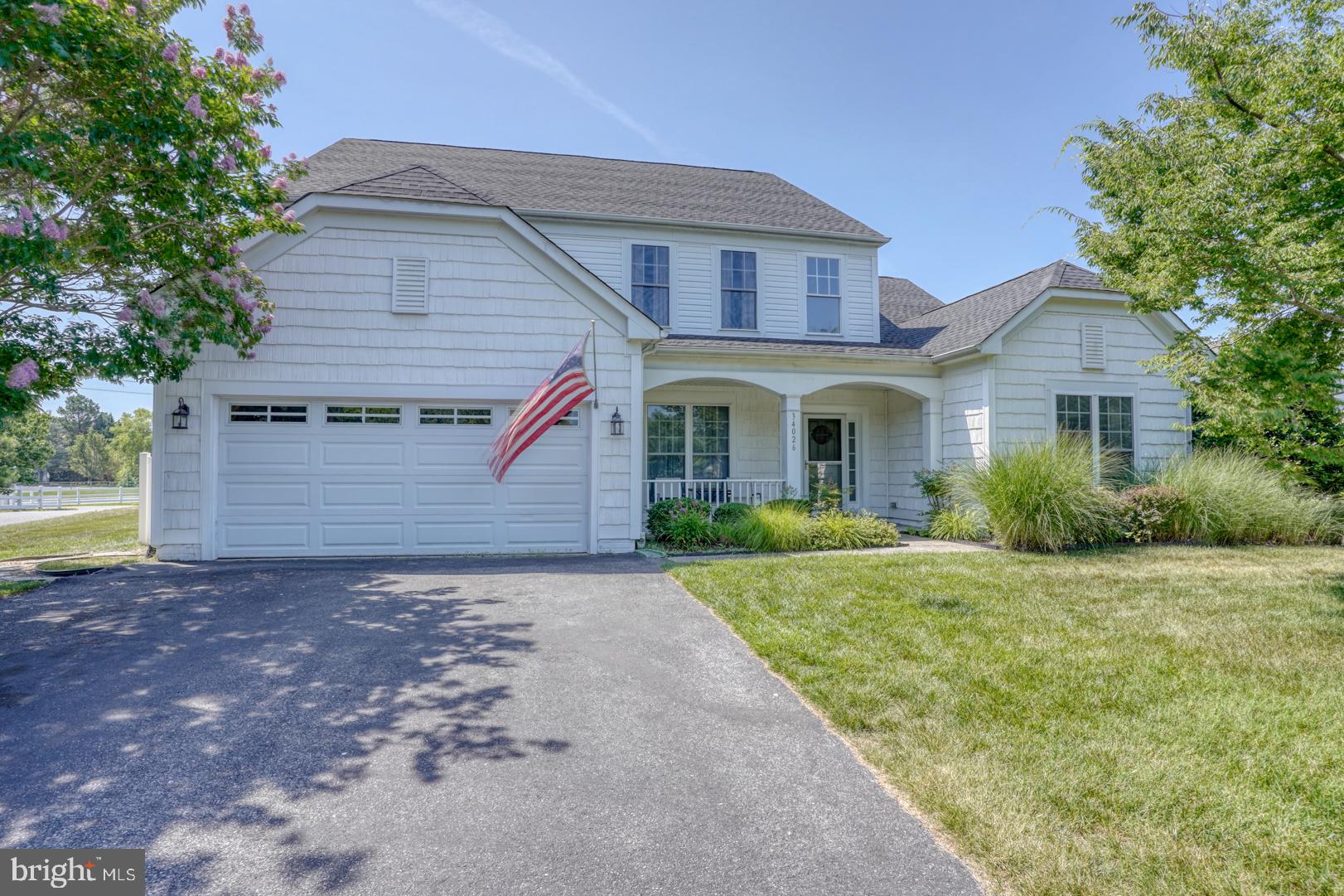 34026 Joyce Court Lewes, DE 19958 - Photo 48 of 48 a front view of a house with a yard and garage