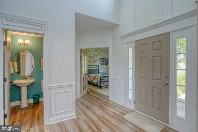 a view of a room that has a bed and a mirror