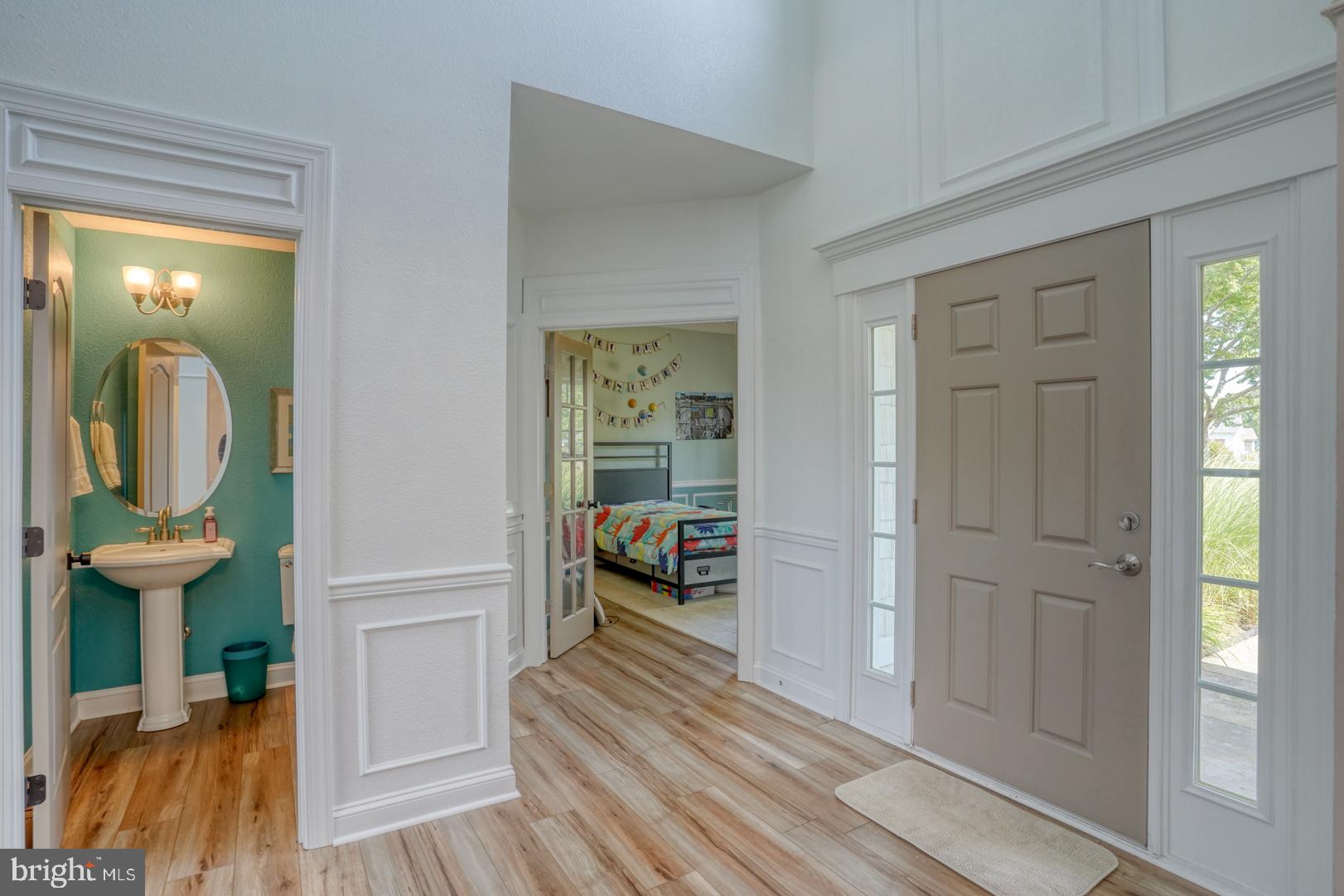34026 Joyce Court Lewes, DE 19958 - Photo 8 of 48 a view of a room that has a bed and a mirror