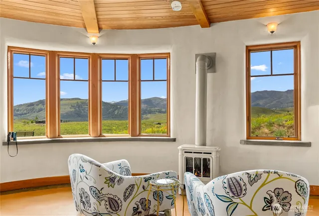 a bedroom with furniture and a window