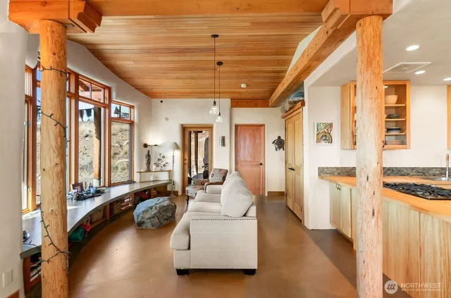 a lobby with furniture and floor to ceiling window