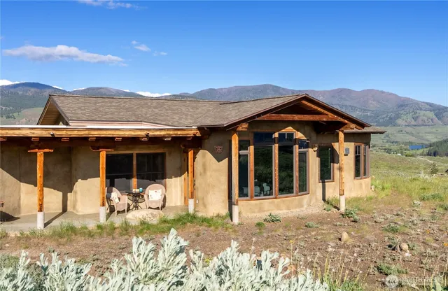 a view of a house with wooden walls