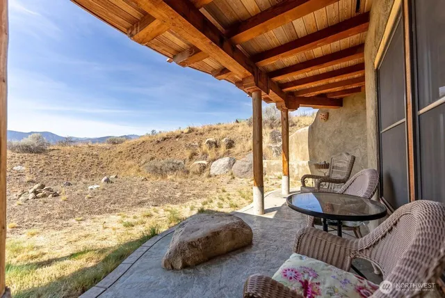 a view of a living room with a couch and a table