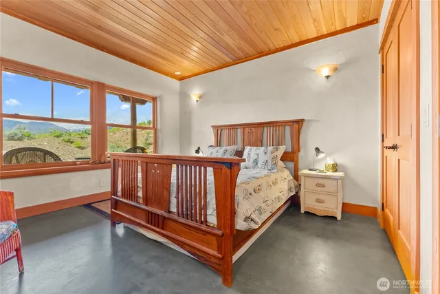 a bed room with a bed and a window