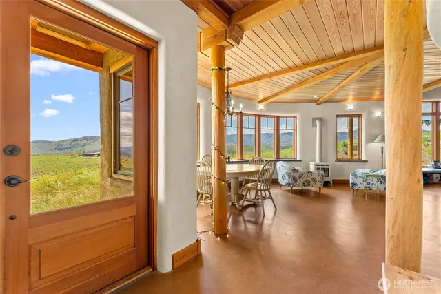a view of living room with furniture and floor to ceiling windows