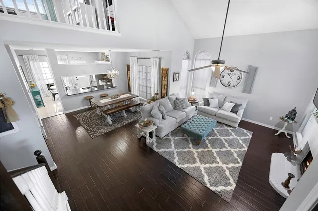 a living room with fireplace furniture and a flat screen tv