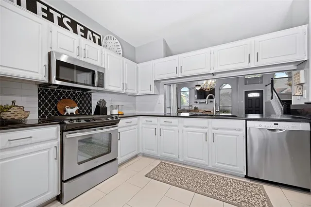 a living room with dining table and a wooden floor