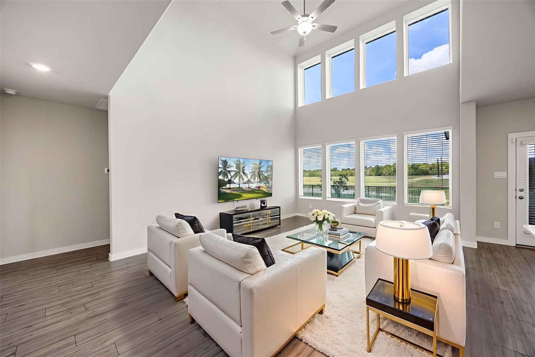 5814 Wayne Way Rosenberg, TX 77471 - Photo 7 of 44 virtual staging - Famiy room with high ceilings, and expansive windows that fill the space with natural light