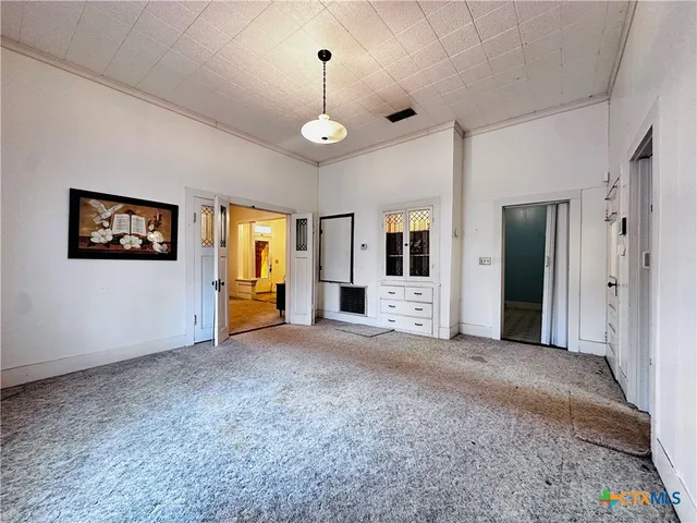 a kitchen with stainless steel appliances granite countertop sink stove and refrigerator