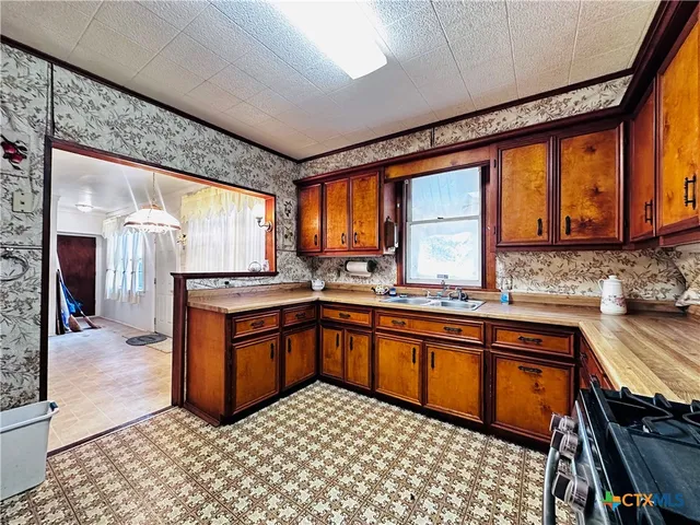 an empty room with closet and windows