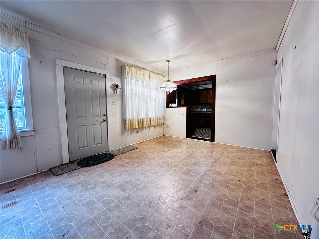 608 Coke Street Yoakum, TX 77995 - Photo 15 of 22 an empty room with closet and windows