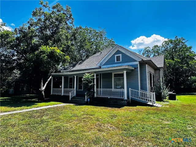 front view of a house with a yard