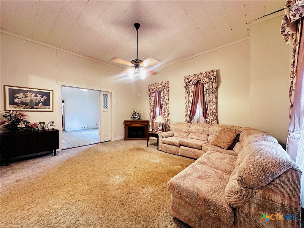 608 Coke Street Yoakum, TX 77995 - Photo 5 of 22 a living room with furniture and wooden floor