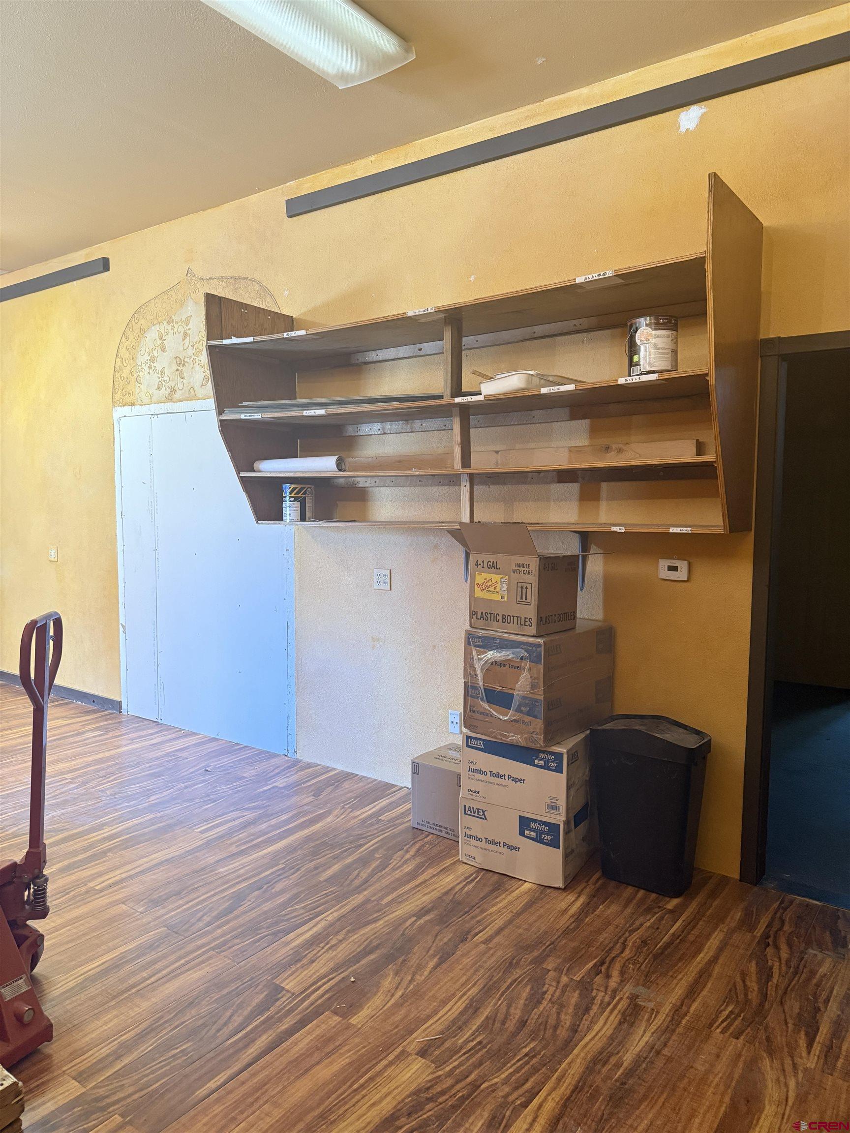 a bedroom with a bed and a cabinets