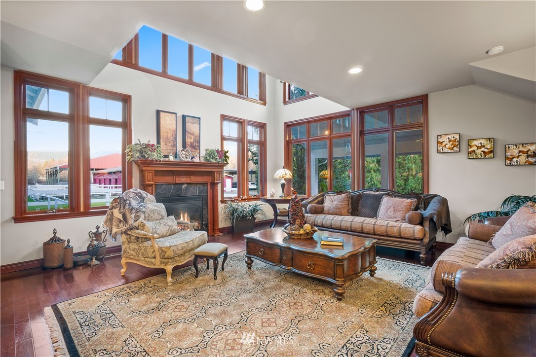 18100 Southeast 132nd Street Renton, WA 98059 - Photo 14 of 33 a living room with furniture fireplace and a table