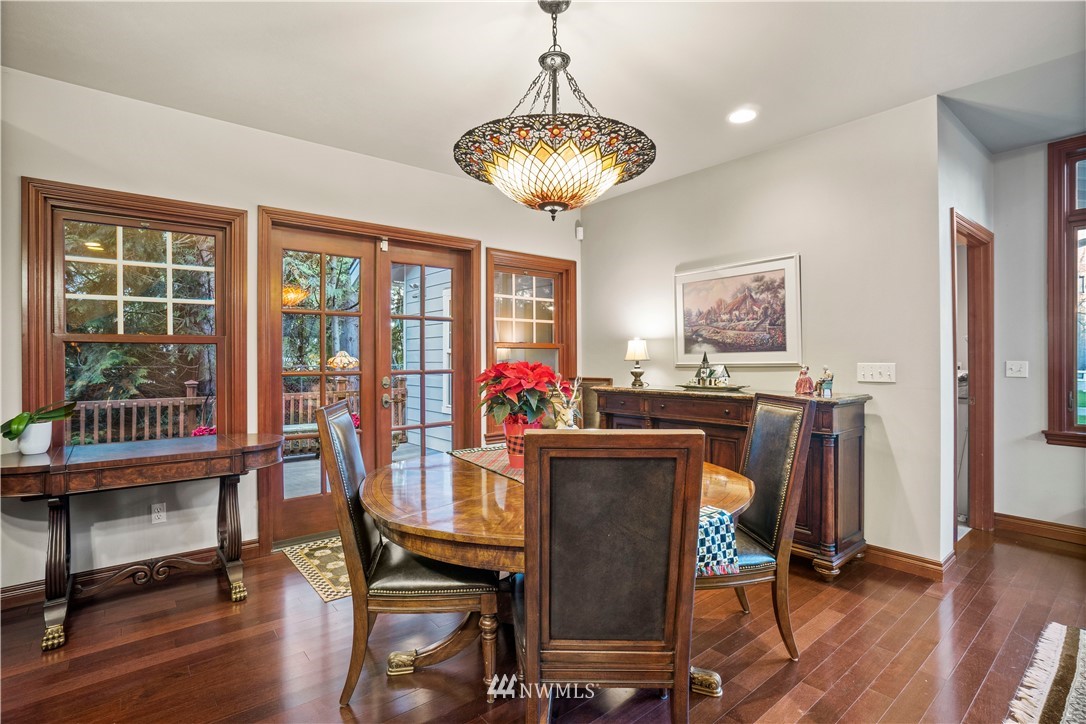 18100 Southeast 132nd Street Renton, WA 98059 - Photo 15 of 33 a view of a dining room with furniture window and wooden floor
