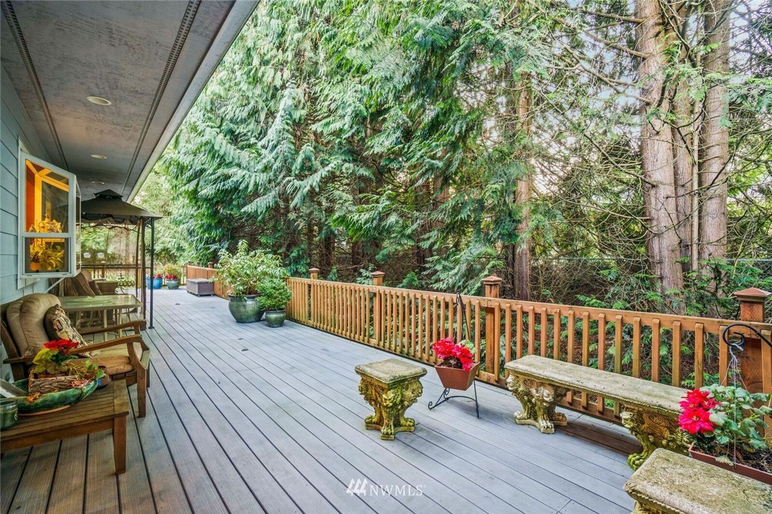 18100 Southeast 132nd Street Renton, WA 98059 - Photo 16 of 33 a view of balcony with wooden floor and outdoor seating