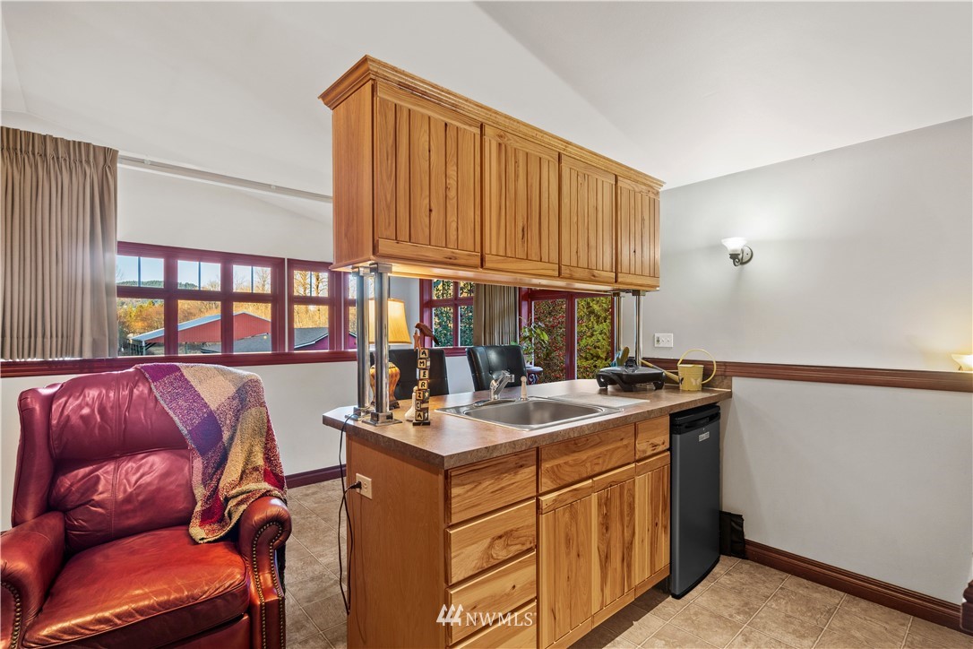 18100 Southeast 132nd Street Renton, WA 98059 - Photo 24 of 33 a kitchen with a sink cabinets and appliances