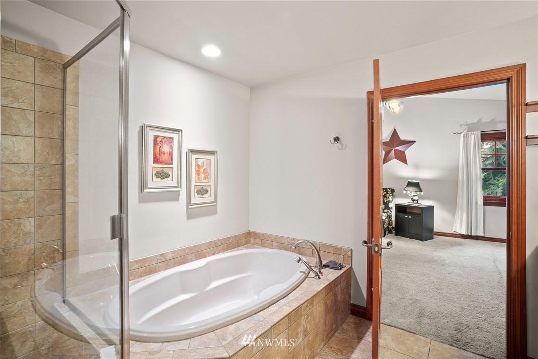 18100 Southeast 132nd Street Renton, WA 98059 - Photo 26 of 33 a spacious bathroom with a tub and shower