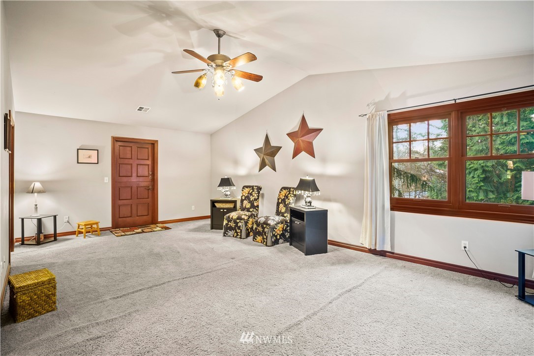 18100 Southeast 132nd Street Renton, WA 98059 - Photo 28 of 33 a view of a livingroom with furniture and a chandelier