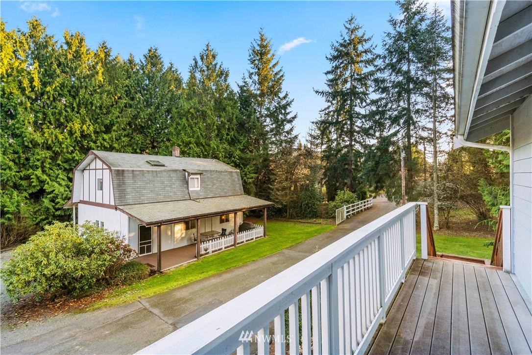 18100 Southeast 132nd Street Renton, WA 98059 - Photo 30 of 33 a balcony with wooden fence and trees