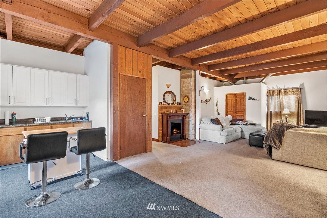 18100 Southeast 132nd Street Renton, WA 98059 - Photo 31 of 33 a view of a livingroom with furniture and a fireplace
