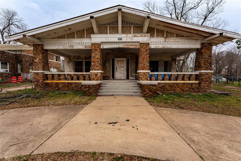 621 South Main Street Paris, TX 75460 - Photo 1 of 30 View of front of house with covered porch and stone siding
