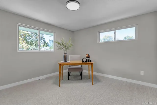 a work room with furniture and a window