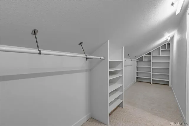 a view of an empty walk in closet