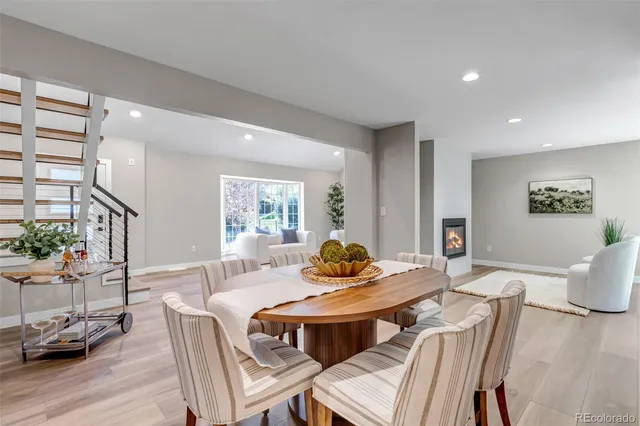a view of a dining room with furniture window and wooden floor