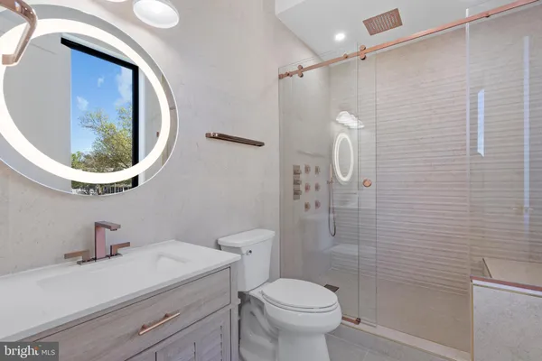a kitchen with stainless steel appliances a refrigerator sink and microwave