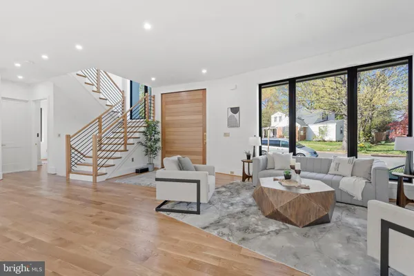 a living room with furniture and flat screen tv