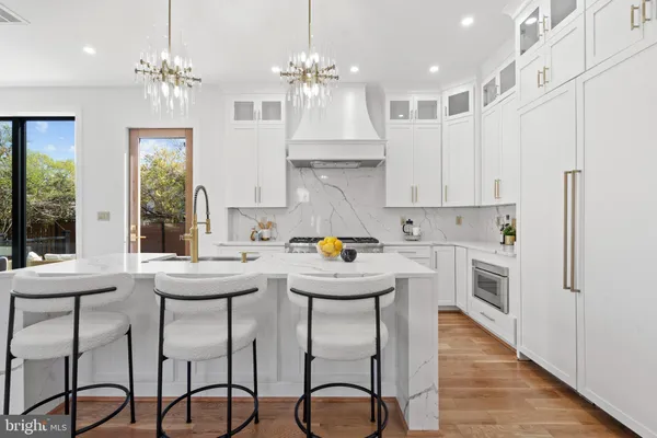 a kitchen with stove and a sink