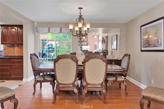 a kitchen with stainless steel appliances granite countertop wooden cabinets a stove a sink and dishwasher