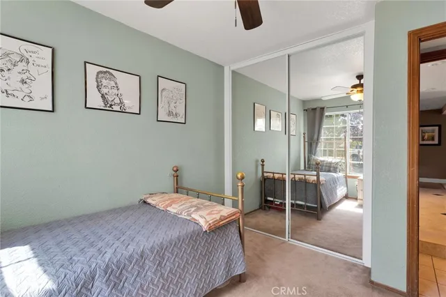a utility room with cabinets washer and dryer