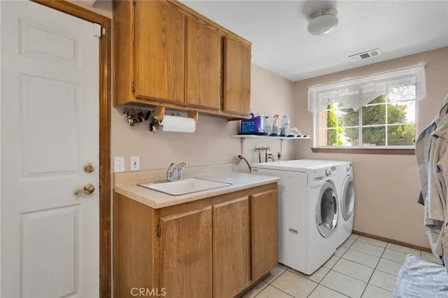 a bedroom with a bed and dresser with mirror