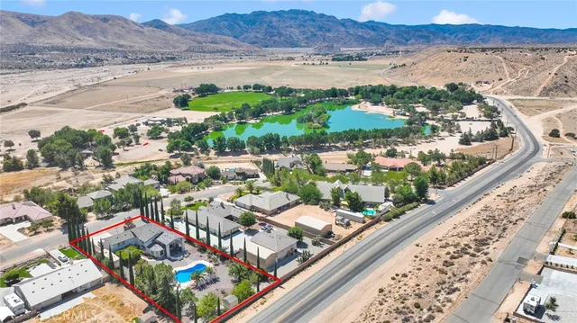 a view of a house with a patio and sitting area