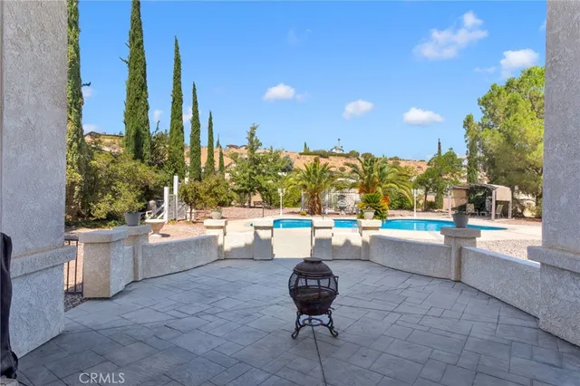 a view of a swimming pool with a patio