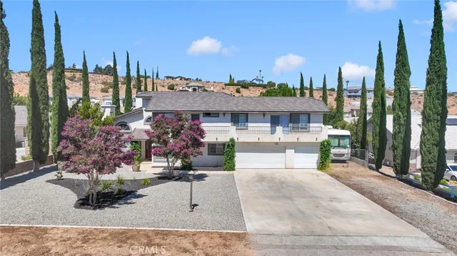 a view of a parked cars in front of a house