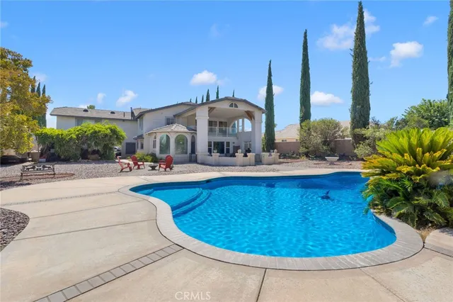 a swimming pool with wooden fence