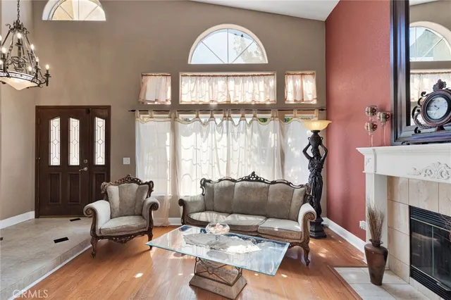 a view of entryway livingroom and hall with wooden floor