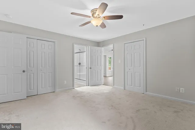 a bathroom with a granite countertop sink mirror and double