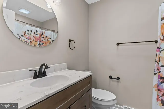 an empty room with a empty space and windows