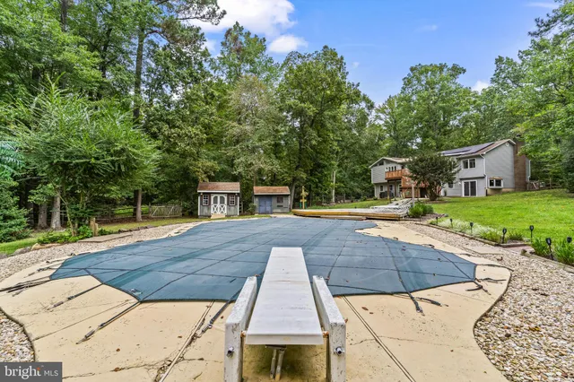 a view of outdoor space with deck and trees