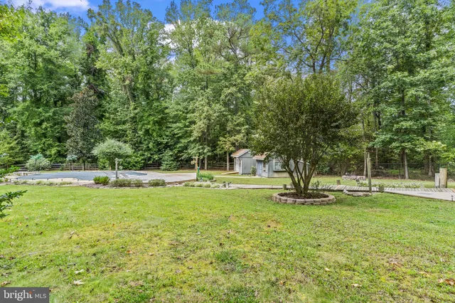 a view of a house with a yard and garage