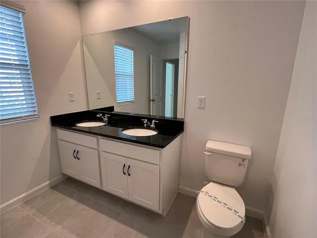 a bathroom with a shower and a toilet