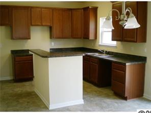 11623 Tucker Field Road Midland, NC 28107 - Photo 2 of 8 a kitchen with stainless steel appliances granite countertop a sink stove and cabinets