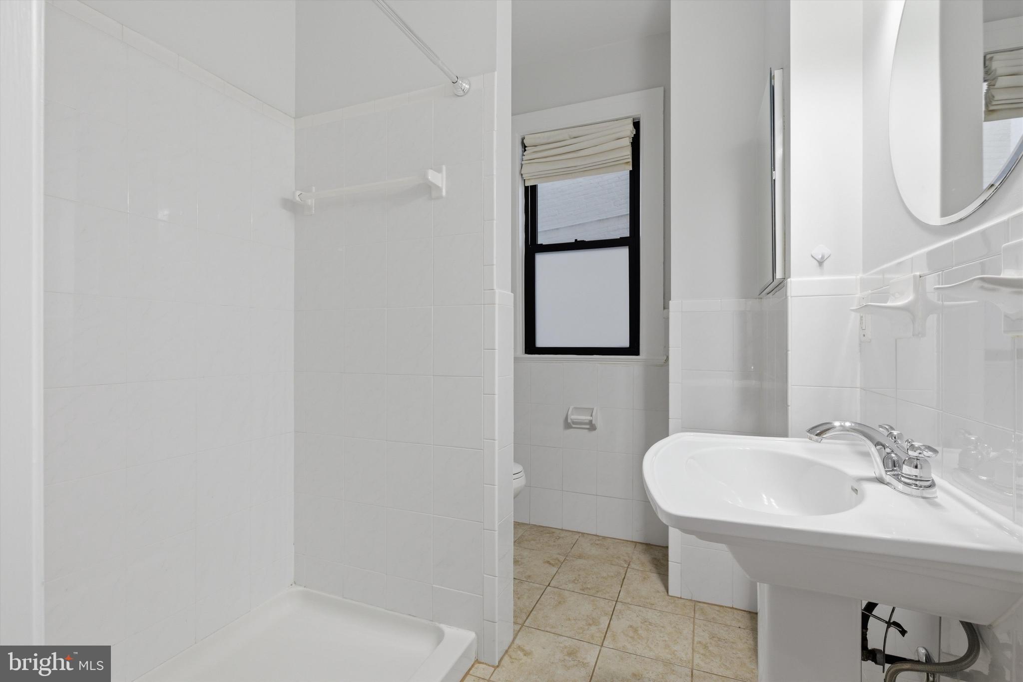 1613 Harvard Street Northwest, Unit 114 Washington, DC 20009 - Photo 14 of 22 Clean, stylish bathroom updates