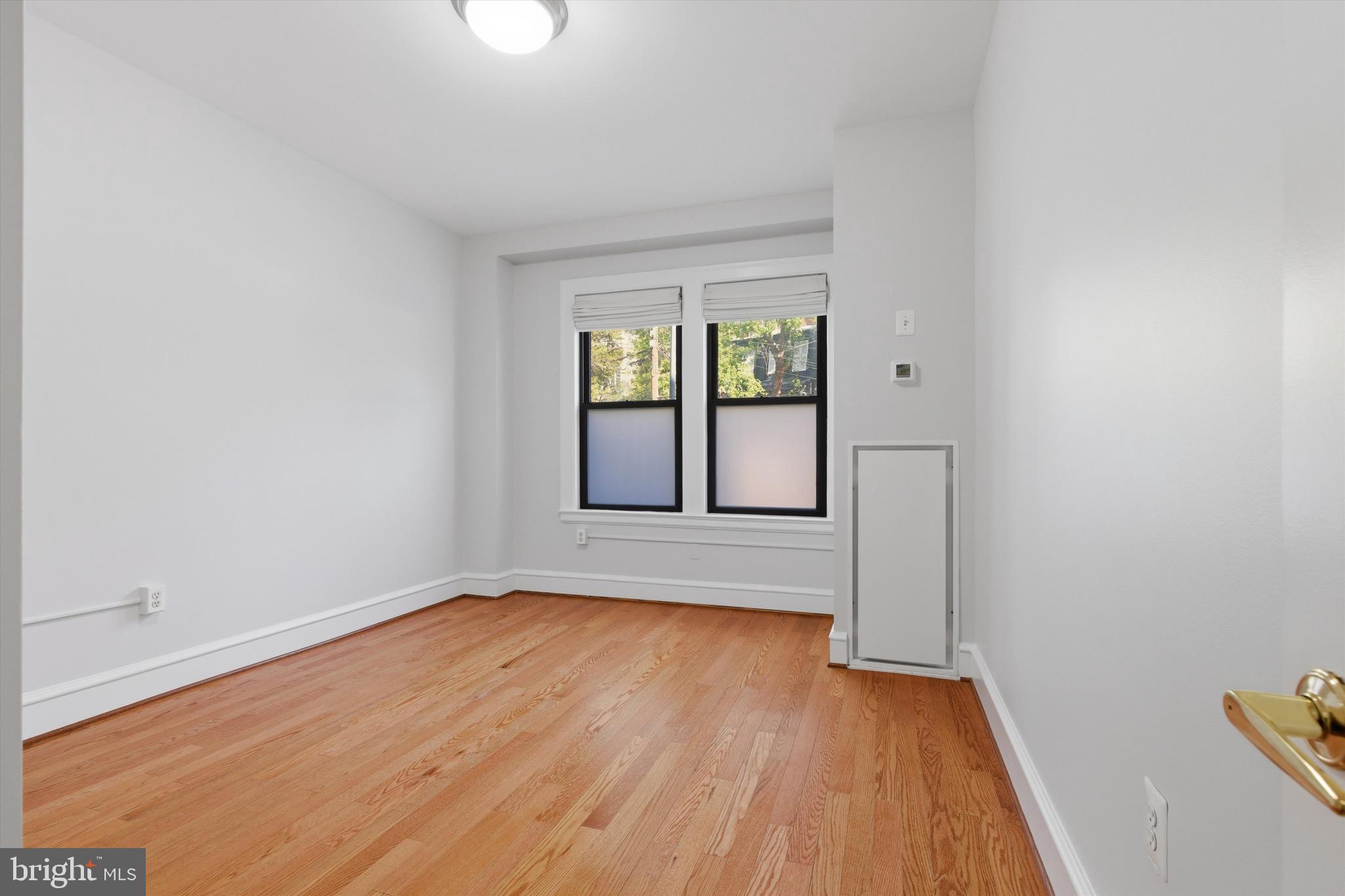 1613 Harvard Street Northwest, Unit 114 Washington, DC 20009 - Photo 9 of 22 Bright, comfortable bedroom space