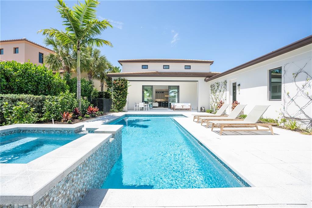16708 Lucarno Way Naples, FL 34110 - Photo 19 of 46 a swimming pool with outdoor seating and yard